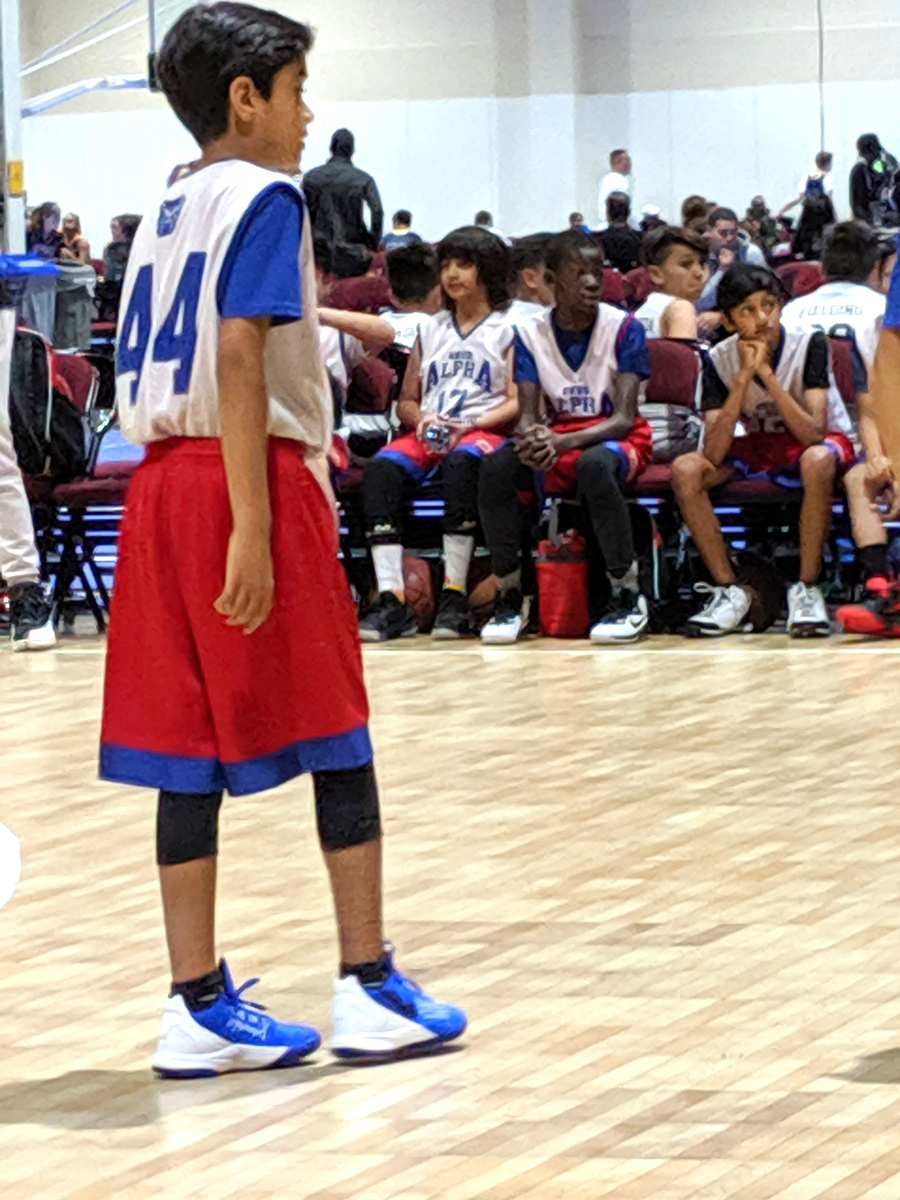 boy playing basketball for East Bay Bulldogs