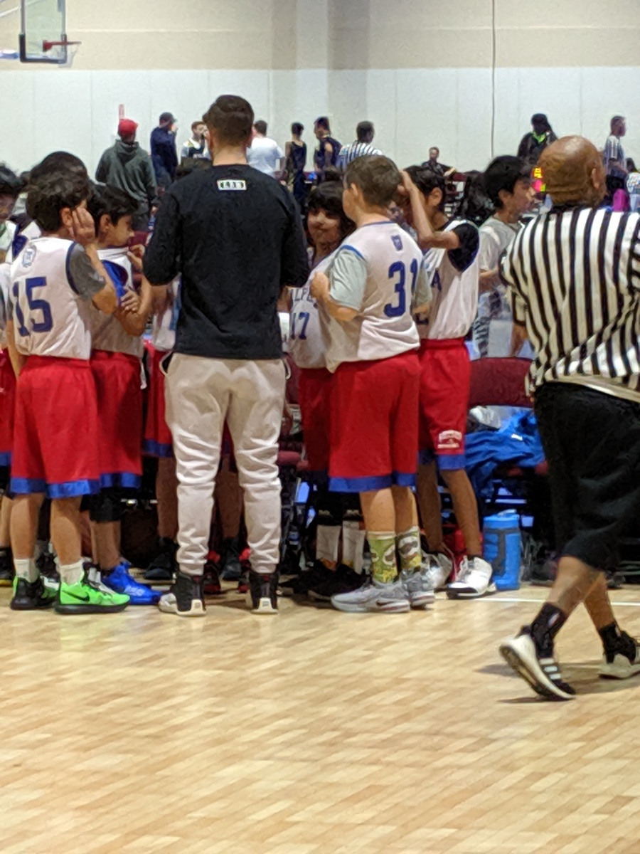 coach Paul during time out with team